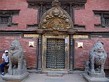 Kathmandu Patan Durbar Square 15 Two Snow Lions Guard The Golden Gate Sun Dhoka Entrance Doors to Patan Museum With the Gilded Torana Above 